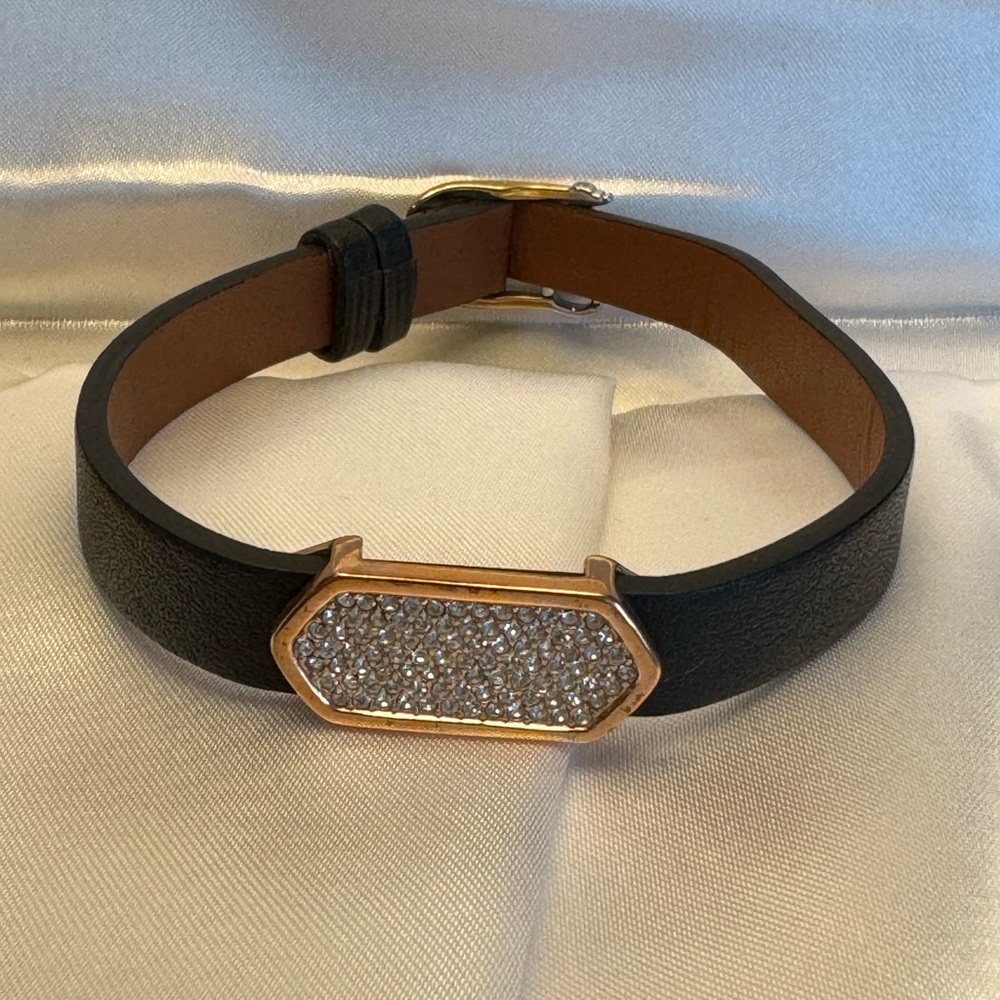 KEEP Collective bracelet with large rose gold center charm with gems.